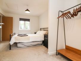 A bedroom with a bed and bedside table at 24 Higher Gorse Road Roughton