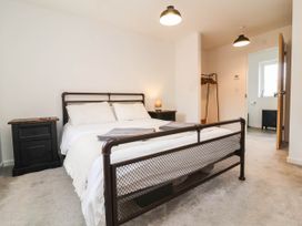 A bedroom with a bed and nightstand at 24 Higher Gorse Road Roughton