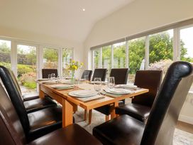 A dining room with a table set for a meal at Seveock in Threemilestone