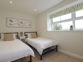 A bedroom with two beds and a window at Seveock in Threemilestone