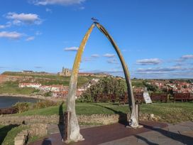 A whalebone arch with a coastal view at Apartment Pink in Whitby