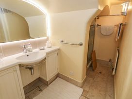 A bathroom with a sink and shower at No 3 By The Sea in Weymouth