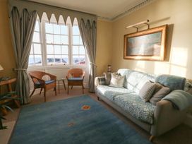 A living room with a sofa and armchairs at Number 3 by the Sea in Weymouth