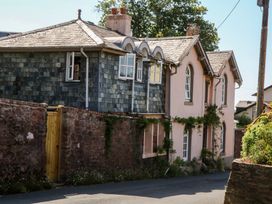 An exterior view of a house with a garden at Gorway Cottage in Teignmouth