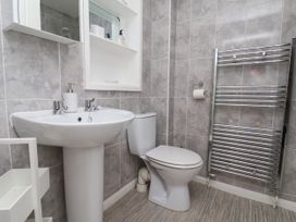 A bathroom with a sink and a toilet at Wheeldale Cottage Goathland