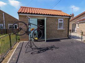 A bicycle on a workstand outside a garage at Wheeldale Cottage in Goathland