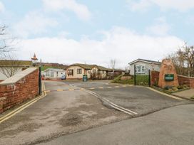An entrance to a residential park with houses at Heskett in Carlisle