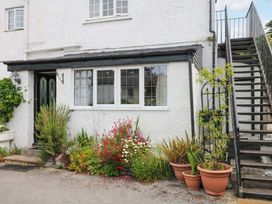 A house exterior with a flower bed and stairs at The Headmasters Quarters in Chudleigh
