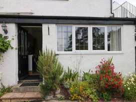 An entrance with a door and plants in front at The Headmasters Quarters in Chudleigh