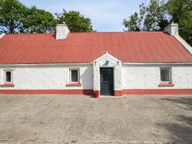 A house with a red roof and a door in front at Gullane East, Rathmore, County Kerry