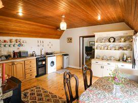 A kitchen with cabinets and appliances at Gullane East in Rathmore, County Kerry