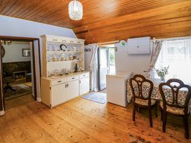 A dining room with a table and chairs at Gullane East, Rathmore, County Kerry