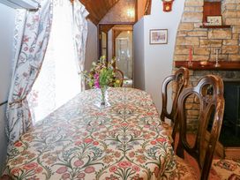 A dining room with a table and chairs at Gullane East in Rathmore, County Kerry
