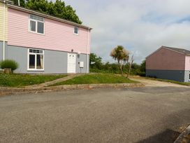 A house with windows and a door outside at 4 bed number 20 Newquay