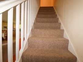 Stairs with carpet and handrail at 4 bed number 20 in Newquay