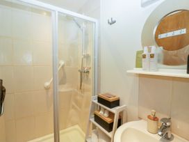 A bathroom with a shower and sink at La'al Yan, Branthwaite