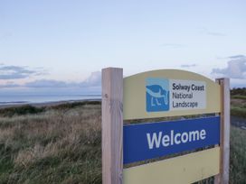 A welcome sign for Solway Coast National Landscape