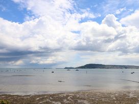 A scenic view of boats on the sea with clouds in the sky at Little Gem in Weymouth