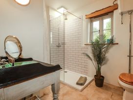 A bathroom with a shower and sink at Cider Cottage