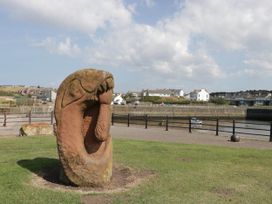 A sculpture in a park near water at 24 Harrington Road Workington