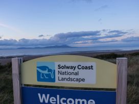 A welcome sign for Solway Coast National Landscape near the sea at 24 Harrington Road Workington
