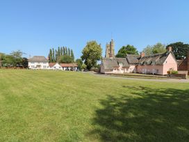 A view of houses and a church tower in an outdoor area at The Annex in Cavendish Near Sudbury