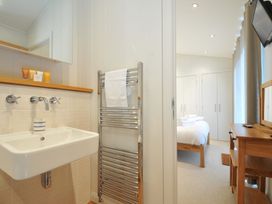A bathroom with sink and towel rack at 11 Water's Edge near Pelynt