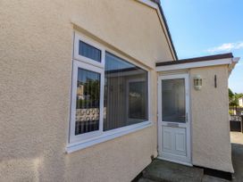 An exterior view showing a door and window at Ger y Mynydd, 2 Cae  Ty Coch in Brynteg