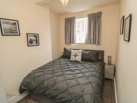 A bedroom with a bed and bedside table at Memory Maker in Bridlington