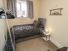 A bedroom with a bed and a window at Memory Maker in Bridlington