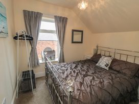 A bedroom with a bed and window at Memory Maker in Bridlington