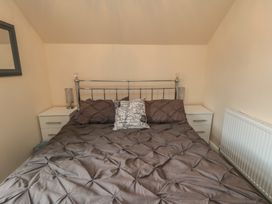 A bedroom with a bed and bedside tables at Memory Maker in Bridlington