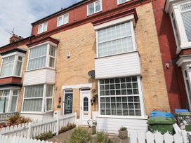 A building facade with windows and a door at Memory Maker in Bridlington