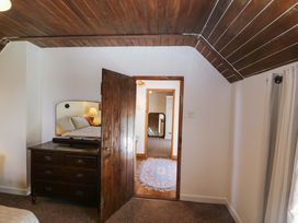A bedroom with a bed and dresser at Tach Ferme in 