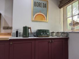 A kitchen counter with kettle and toaster at Llysawelon 2-Bed Cottage, Sleeps 5, Pets Ok near Llansteffan