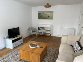 A living room with a television and a coffee table at Apartment Sleeps 4 with Parking in Chagford
