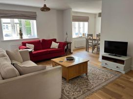 A living room with a sofa and coffee table at Apartment Sleeps 4 with Parking, Chagford