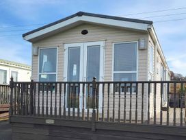 A caravan with a balcony at BandR Turnberry Escape Scotland, Girvan