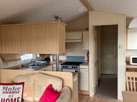 A kitchen with a stove and sink at Beautiful 2 Bed Static caravan
