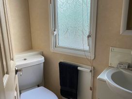 A bathroom with sink and toilet in Beautiful 2 Bed Static caravan 