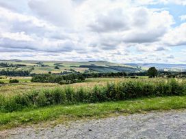 A landscape with hills and trees at Pet Friendly - Lodge at Riverview Holiday Park, Mangerton near Newcastleton