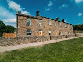 A house with multiple windows and doors at Foundry Farm Apartment