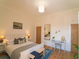 A bedroom with a bed and a desk at Foundry Farm Apartment in 