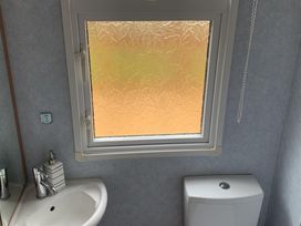 A bathroom with a sink and toilet at Static Caravan  2 Bedrooms  - sleeps 4, Hawick