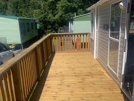 A deck area with wooden flooring at Static Caravan 2 Bedrooms - sleeps 4 in Hawick