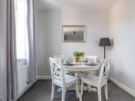 A dining room with a table and chairs at Lily Apartment - Sleeps 3 - Pet friendly - Parking in Bedlington