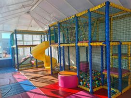 A play area with climbing structure and slide at 3 Bed, Sleeps 6, Parking