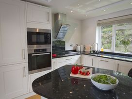 A kitchen with appliances and vegetables at 6 Knowle Court in Salcombe