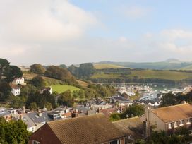 View of houses and boats near water at 6 Knowle Court in Salcombe