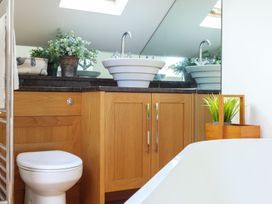 A bathroom with a sink and a toilet at 6 Knowle Court in Salcombe